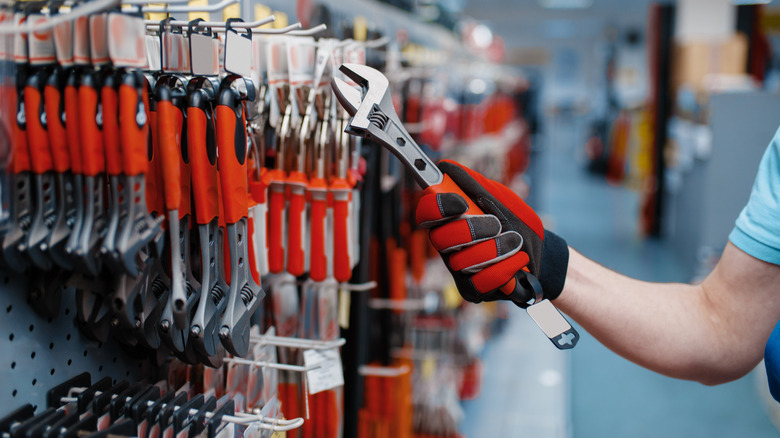 Man buying wrench