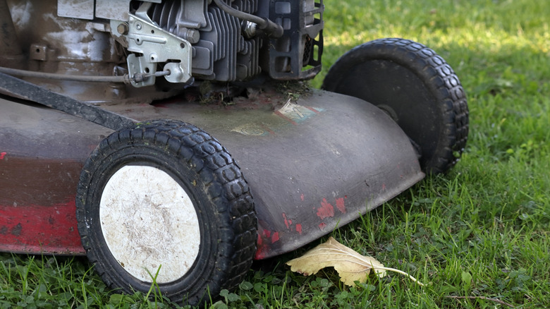 A close-up shot of the tires of an old lawn mower.