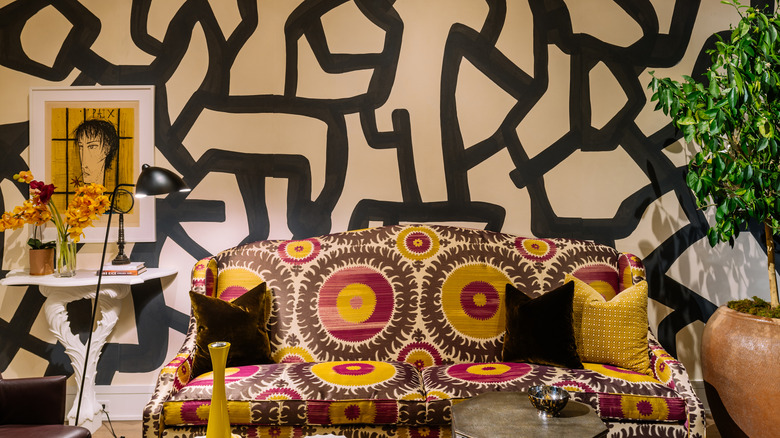Living room with large scale wallpaper pattern