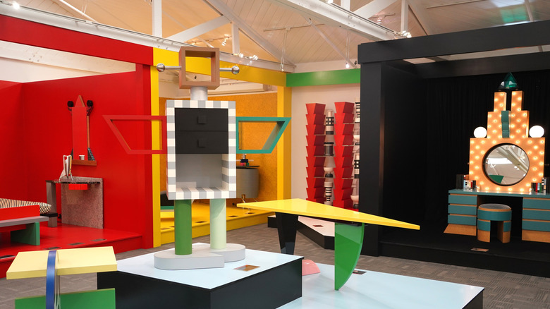A room filled with furniture in geometric shapes and bright colors.