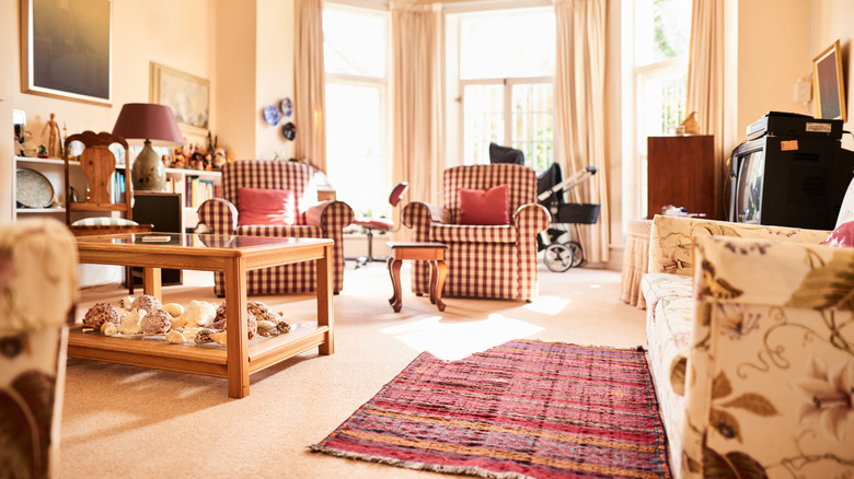 Patterned couches and chairs in a vibrant living room