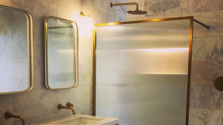 Renovated bathroom with fluted glass