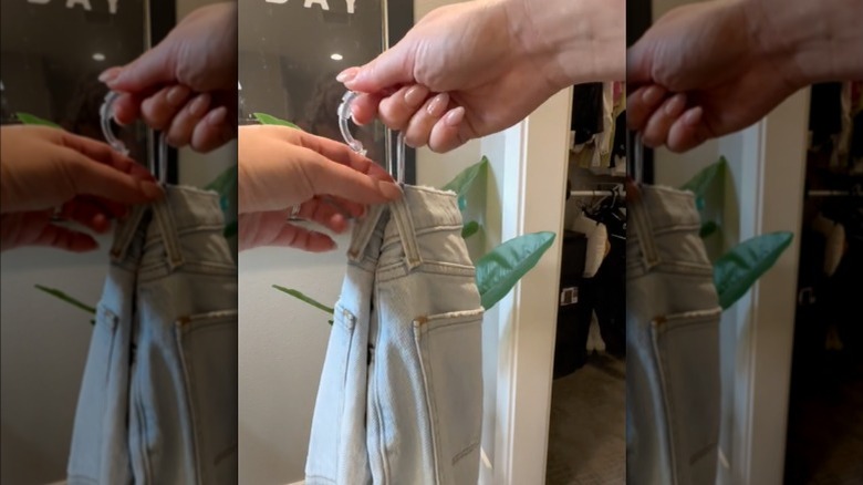 jeans on a shower hook