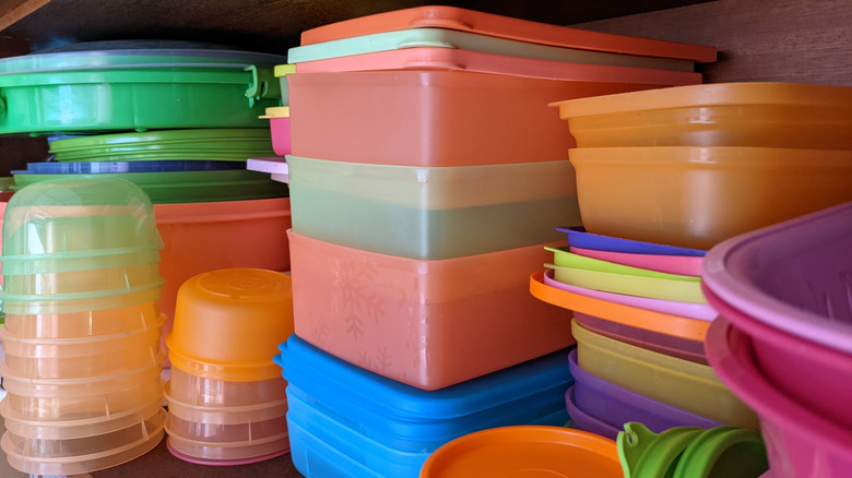 Tupperware stacks in cabinet