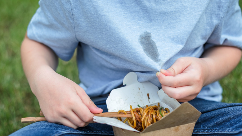 Oil stain on blue shirt