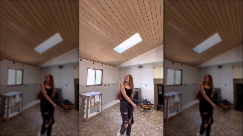 woman standing under planked ceiling