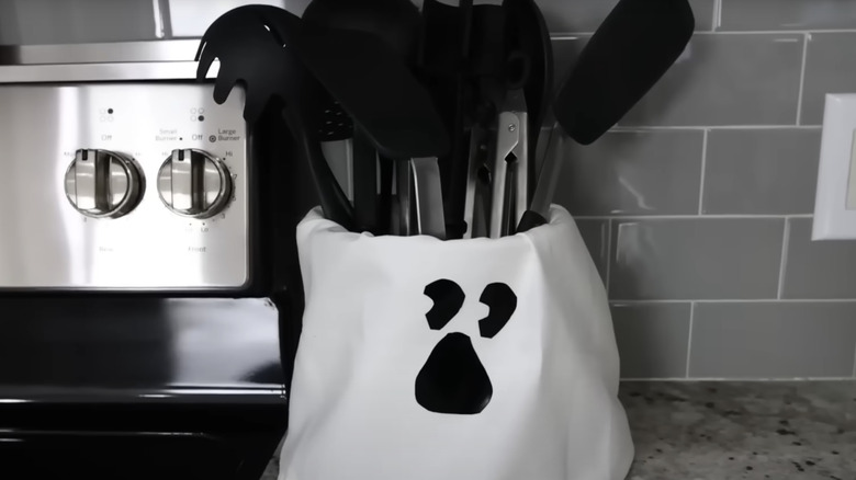 a ghost face utensil holder