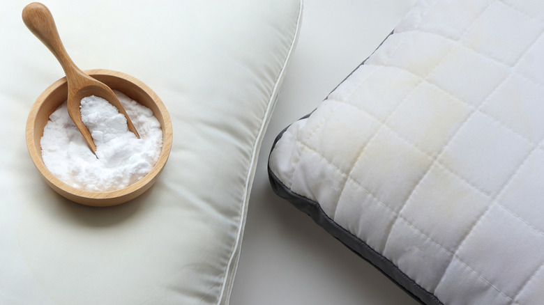 Stained and clean pillow with baking soda.
