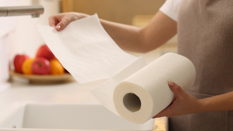Someone pulling a paper towel