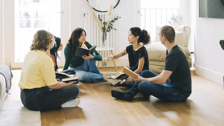 People sitting on living room floor