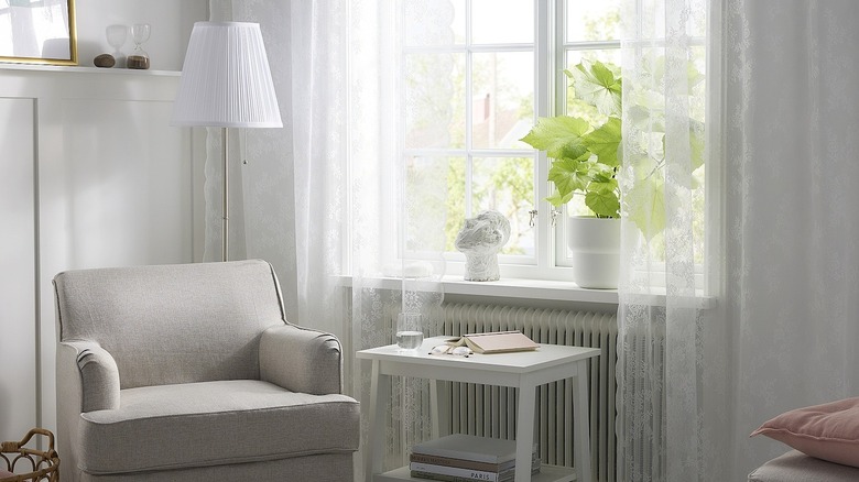 IKEA ALVINE SPETS lace curtains on window in living room