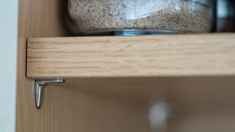 Close up of L-shaped shelf support pin