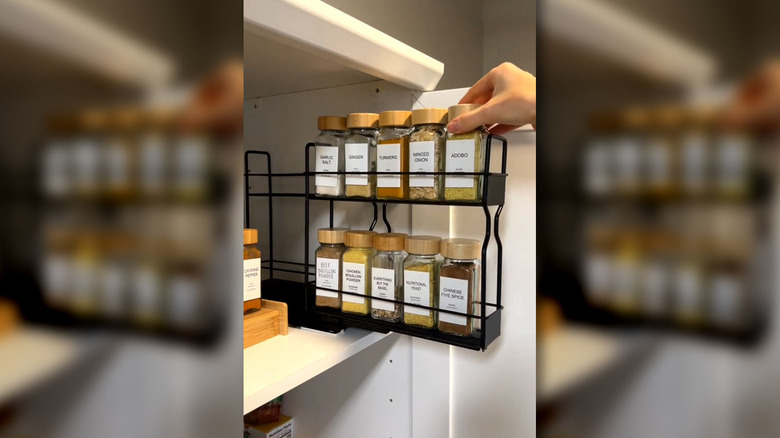 A screenshot showing a sliding space rack inside a kitchen cabinet