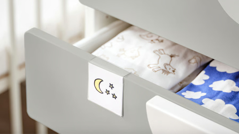 Plastic label holder on dresser drawer