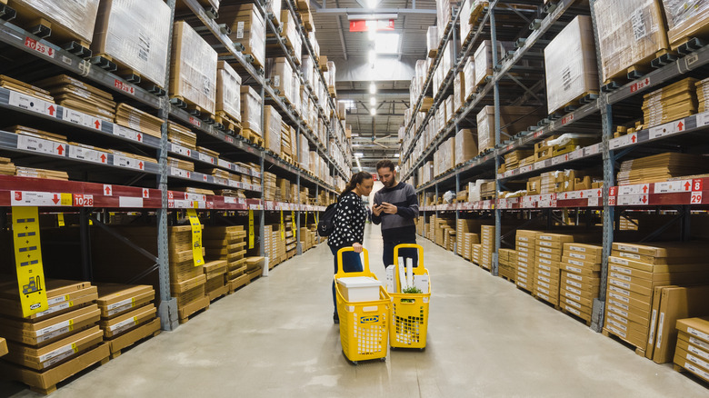 couple shopping at IKEA with yellow carts