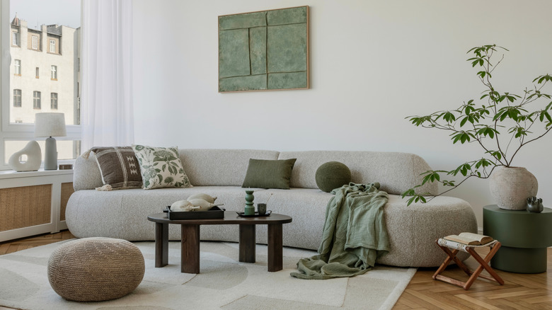A large sofa and natural accents in a small living room