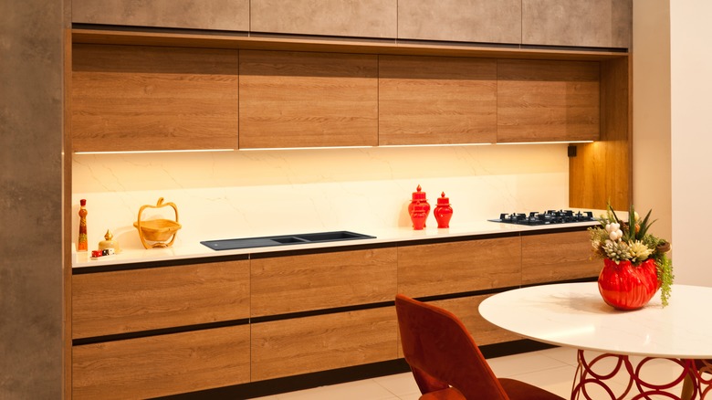 Modern medium-toned wood kitchen cabinets