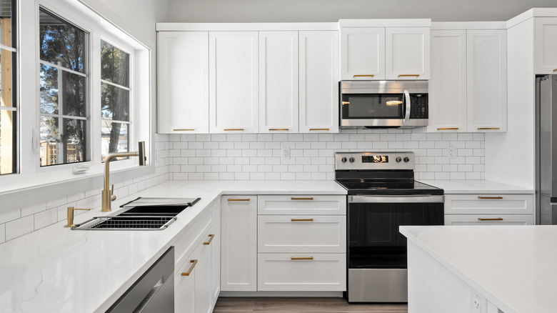 Modern kitchen with all white cabinets