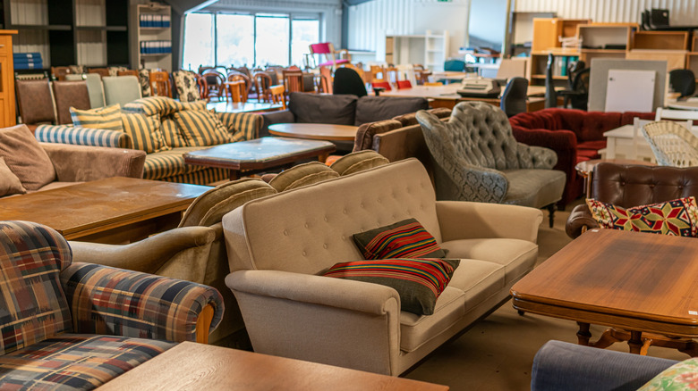 Different styles of couches on the sales floor of a furniture store.