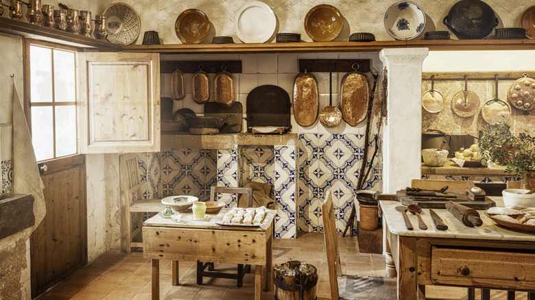 An authentically old kitchen with lots of old fashioned fixtures and features