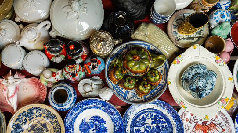 An overhead shot of a table with antique dishware.