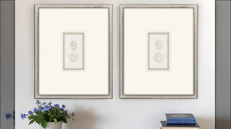 A gallery wall made up of framed intaglios