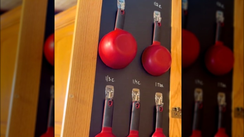 inside cabinet chalkboard measuring cup station