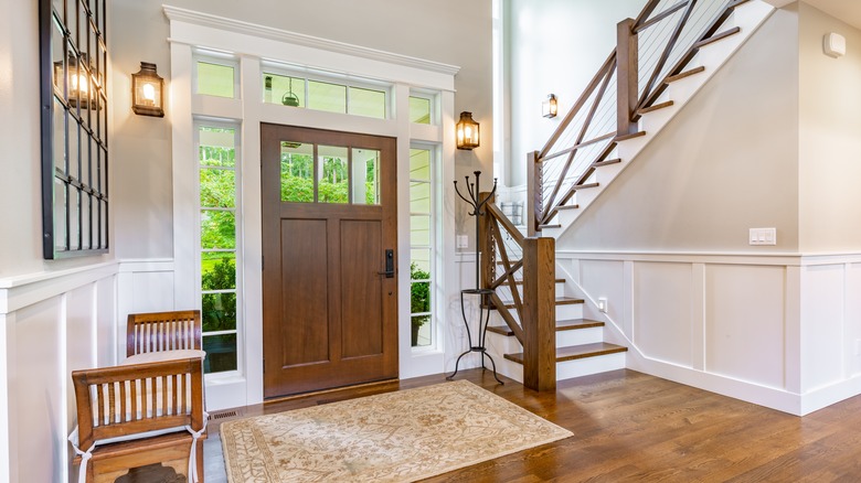 Front entryway with wall sconces