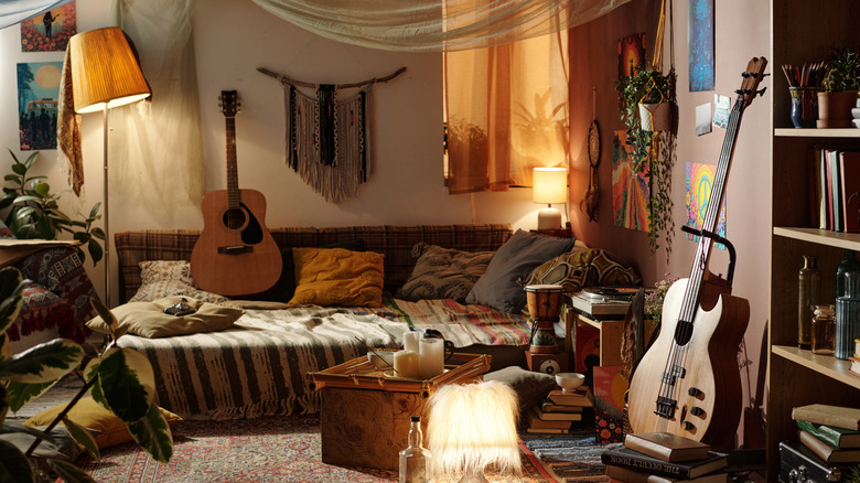 A bohemian living room is pleasantly cluttered with personal belongings.