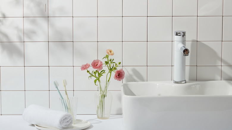 Bathroom with plain white wall tiles