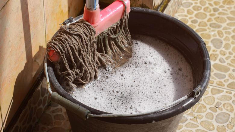 Close-up of soapy mopping water