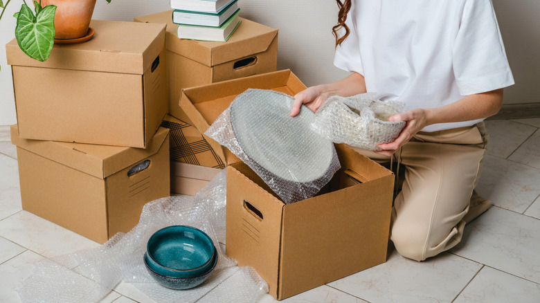 packing dishes in a box