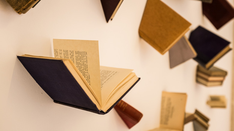 An art installation made of book parts glued to a wall