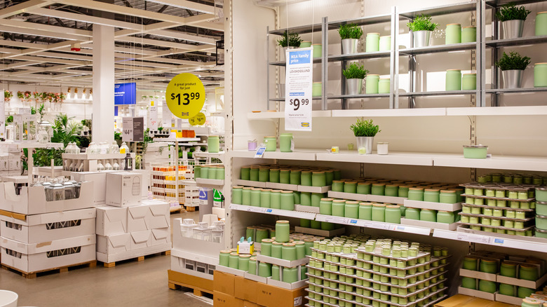 Green jars and other home items on display in an IKEA.