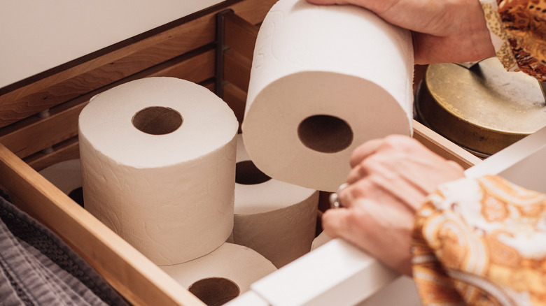 unorganized toilet paper in bathroom 