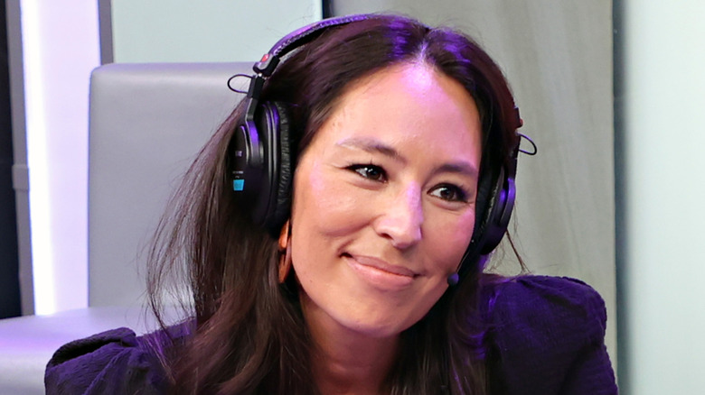 Joanna Gaines wearing headphones in a studio