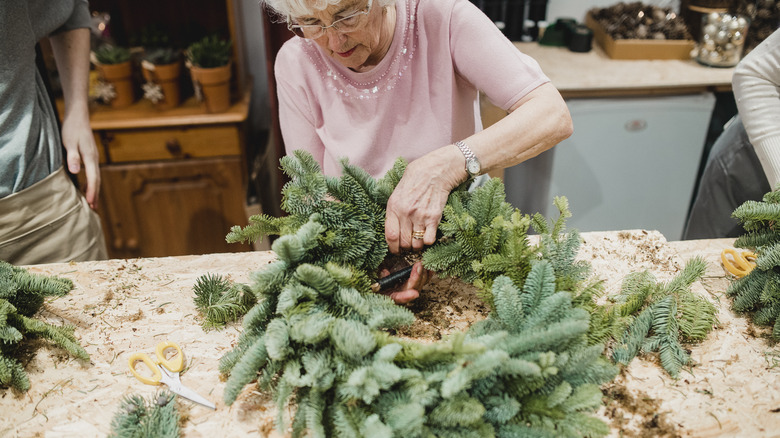 woman making a wreath 