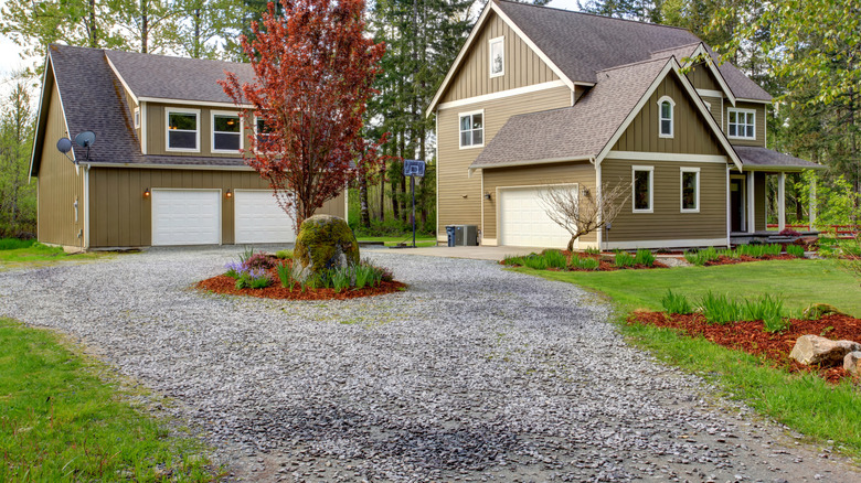 Home with driveway with circular turnaround area.