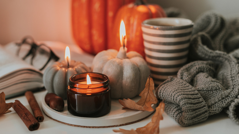 Candle centerpiece with pumpkins