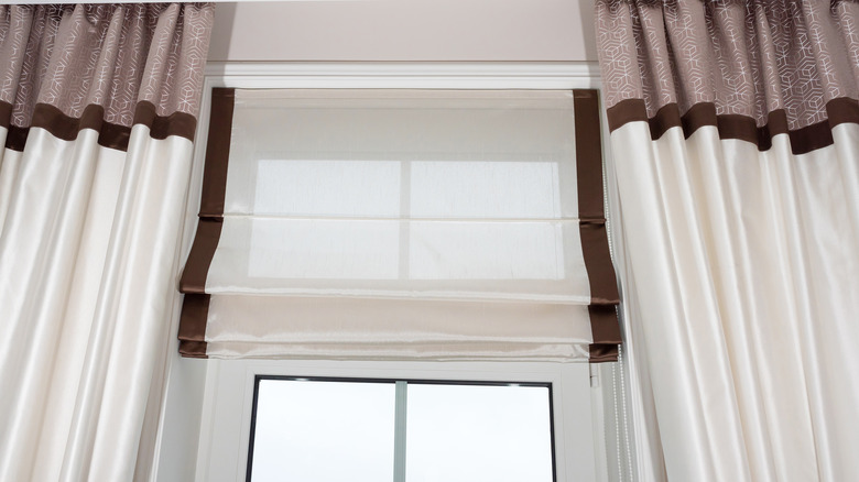 Roman blinds with curtains