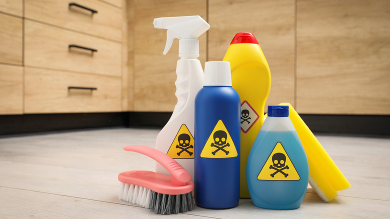 Multiple bottles with poison symbols on them.