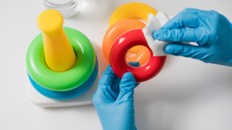 Person cleaning toys
