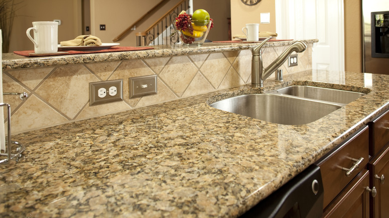 kitchen with light granite countertops