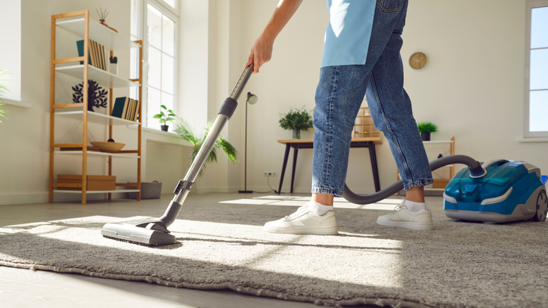 Woman using a vacuum cleaner