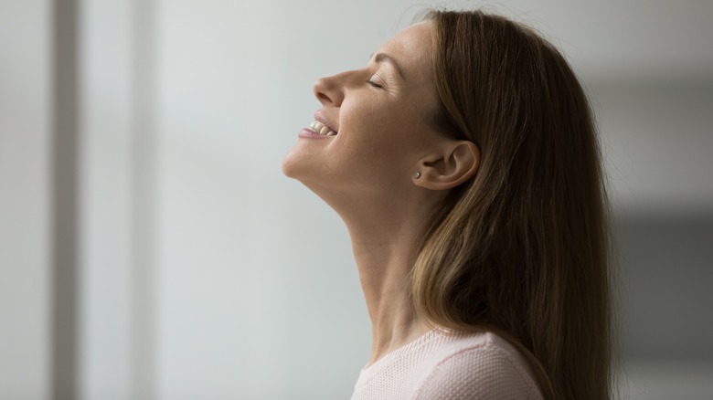 woman enjoys fragrant room