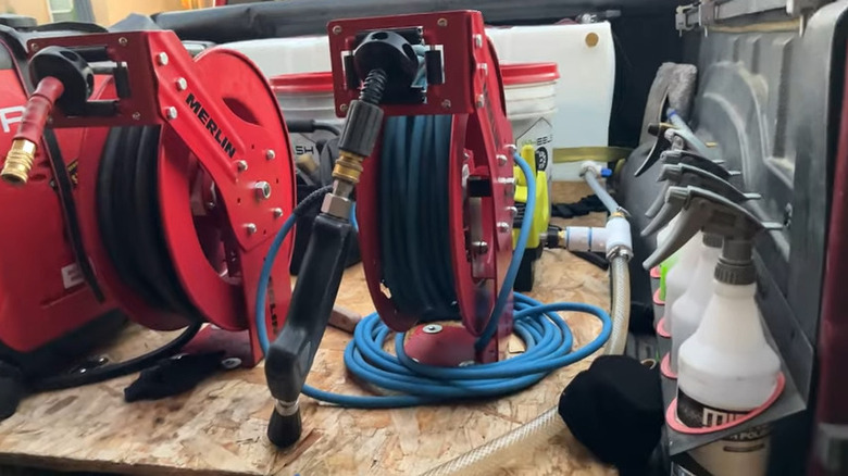 A retrofitted retractable pressure washer hose reel