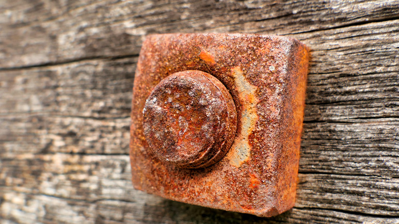 Close-up of an old rusty nut and bolt