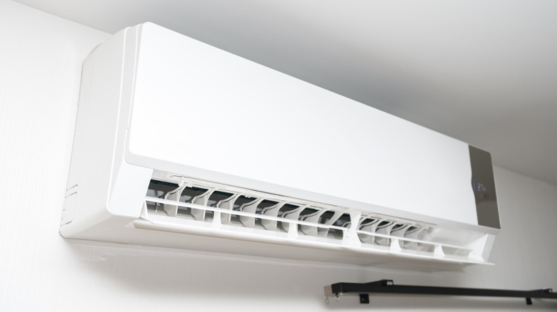 White air conditioning system mounted to wall.