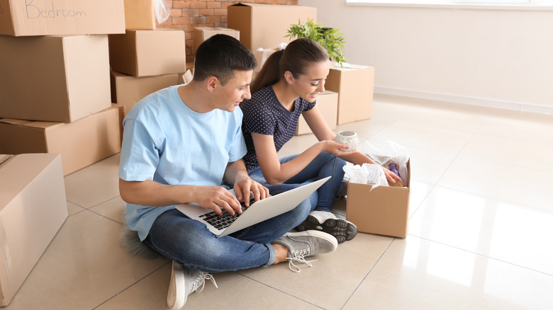 Couple packing for move