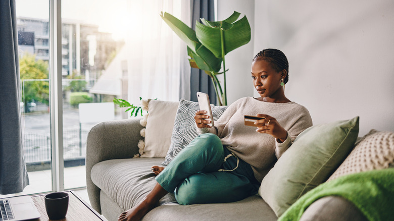 A person shopping online on a phone